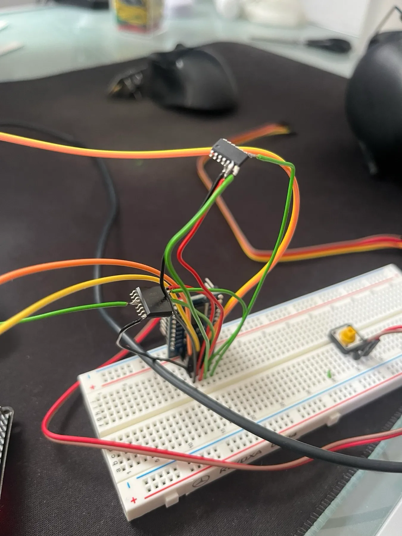 Two small SOIC chips wired directly to a breadboard with loose jumper wires.