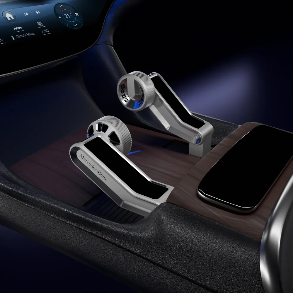 Render of the two Glide handles in a Mercedes-Benz centre console: brushed metal bodies with knurled thumb wheels and dark inlays, set into wood trim beside a curved display.
