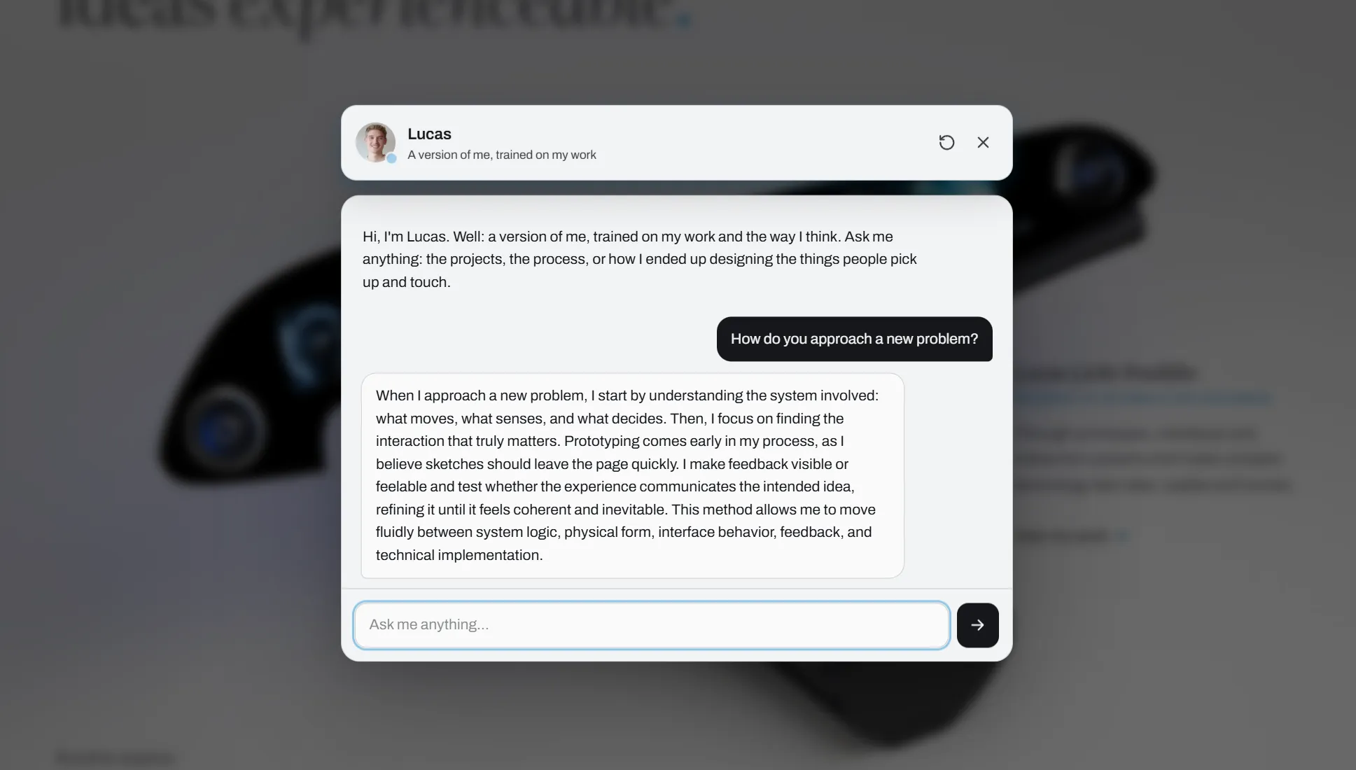 The Lucas-Bot conversation overlay open on the site, its greeting introducing itself as a version of Lucas trained on his work.